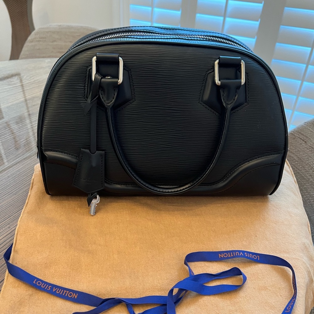 Louis Vuitton Bowling Montaigne PM features an epi leather body